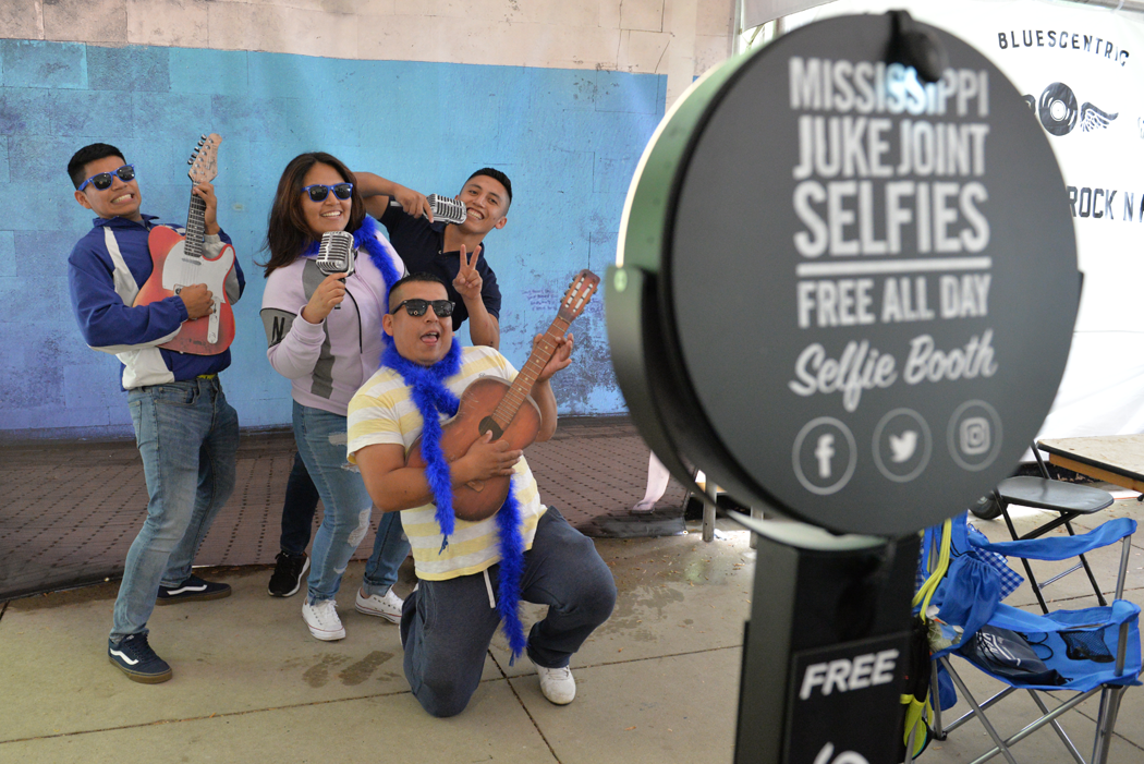 People rocking out at the Selfie Shack